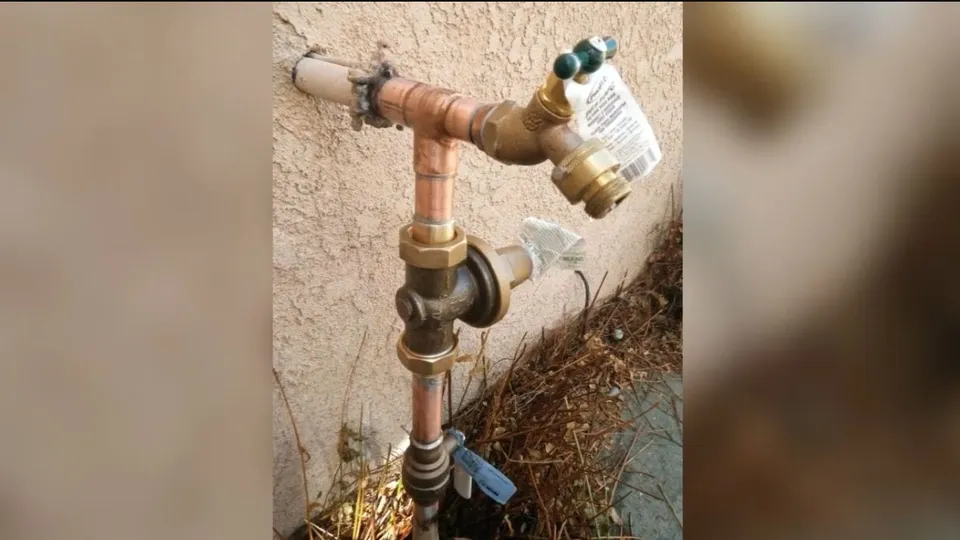 Frozen pipe repair area with insulation or thawing work for Heat tape on a Parker basement pipe