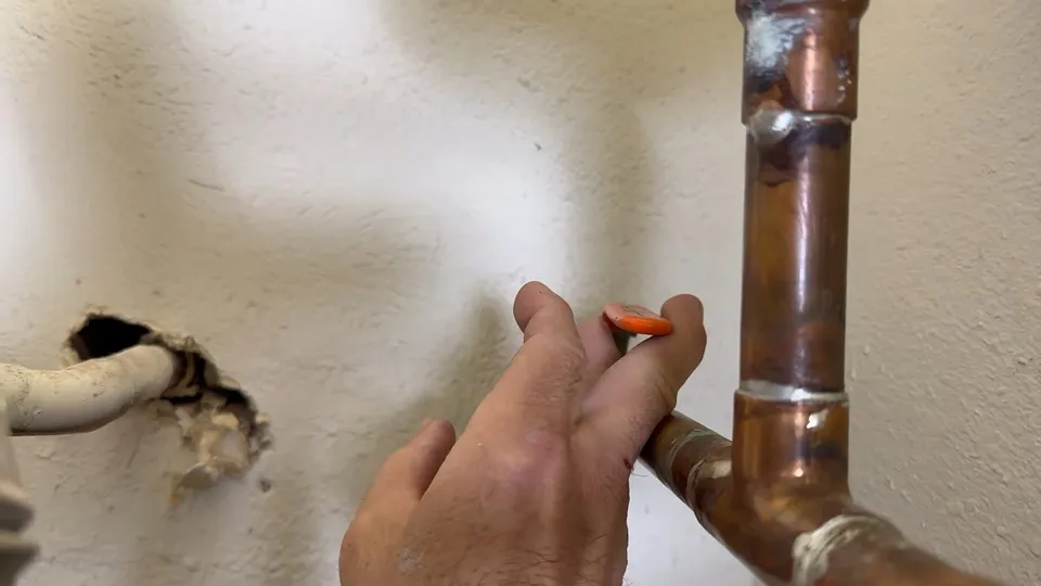 Tank water heater and plumbing connections for Spent anode rod from a Parker water heater