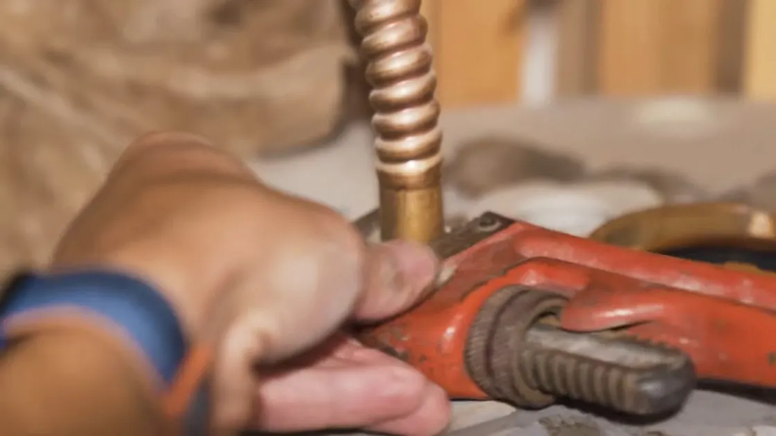 Tank water heater and plumbing connections for Water heater repair in Parker